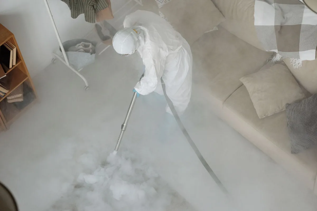 Biohazard cleanup technician in protective equipment, Monticello, MS